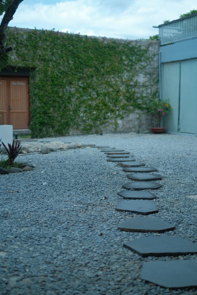 Flat stepping stones set into a gravel path